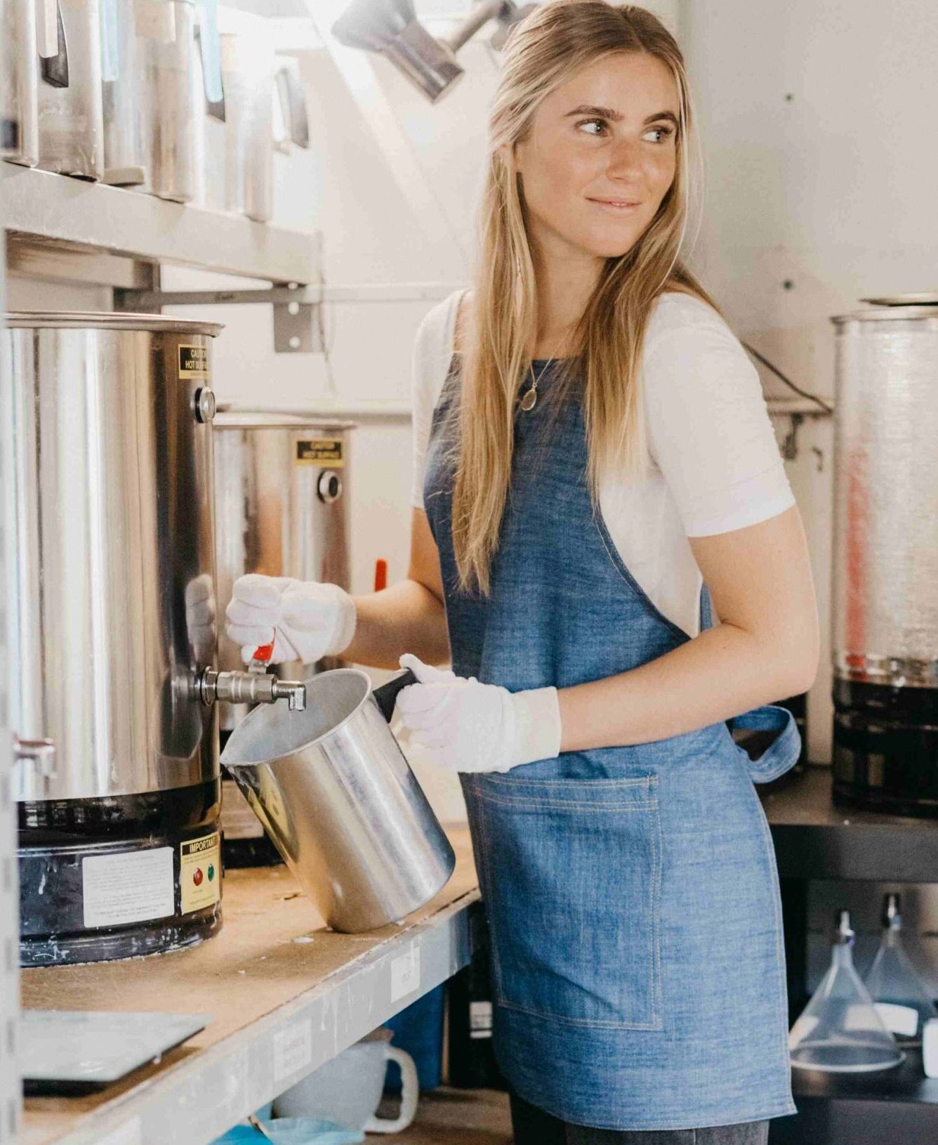 Candles being hand-poured at the Byron Bay Candles factory